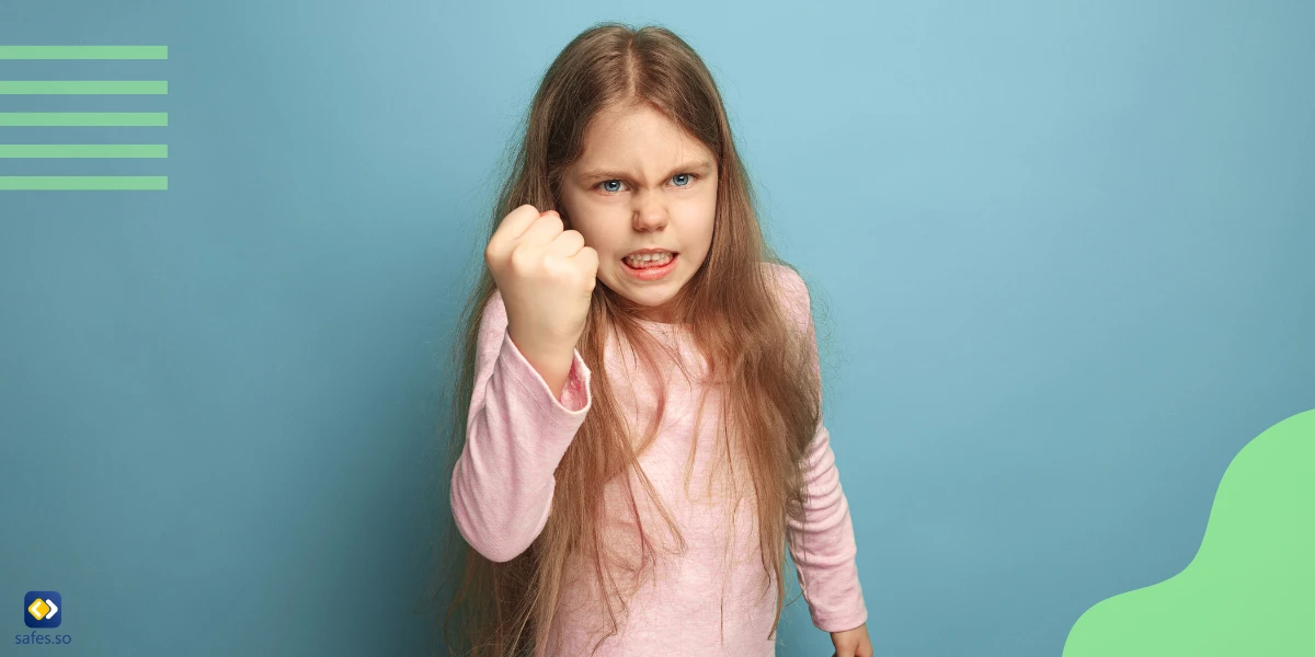 Little girl showing fist to camera