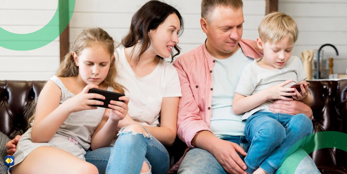a family sitting on a couch and parents are checking how their children are using their phones.